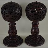 A pair of Chinese metal incense burners in the form of mandarin hat stands,