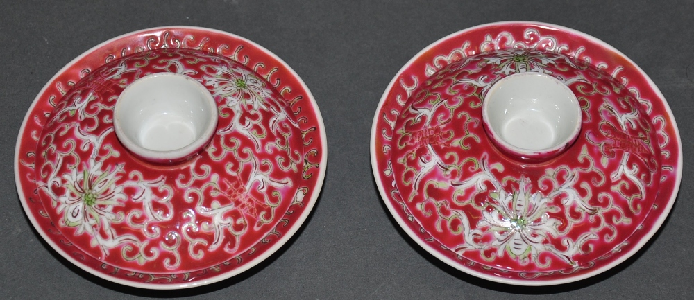 A pair of Chinese porcelain red glazed stem dishes and covers,