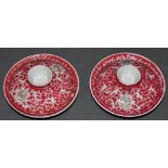 A pair of Chinese porcelain red glazed stem dishes and covers,