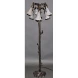 A bronzed standard lamp, in the form of a long-stemmed plant,