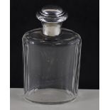 A hallmarked Sterling silver mounted cologne bottle with original stopper & faceted glass body, C.