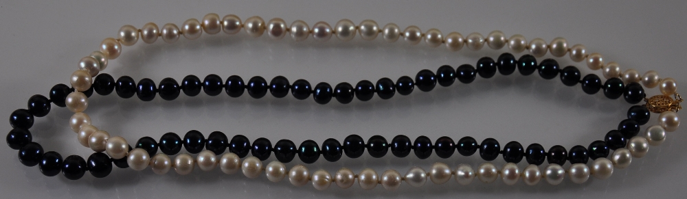 A Chanel style 2 row black and white natural South Sea pearl necklace with 14ct clasp