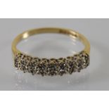 A vintage 9ct diamond half eternity ring