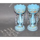 A pair of late Victorian pale blue glass lustres, flower decorated with clear glass drops, H. 33cm.