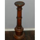 An unusual wooden pricket candlestick.