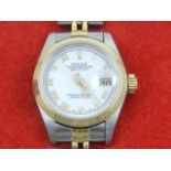 A ladies Rolex oyster perpetual date wristwatch, having original box and papers.