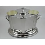 A silver plated two-bottle wine cooler, having ice compartment.