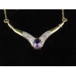 A 9 carat yellow gold and amethyst drop pendant necklace, set with diamond accents.