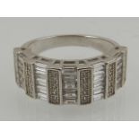 A silver and cubic zirconia half eternity band ring,