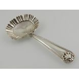 A silver caddy spoon, hallmarked Birmingham.