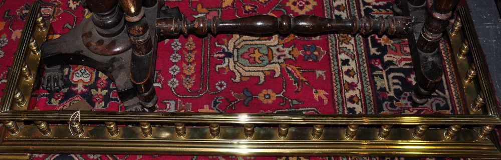 An Edwardian brass fender, W.