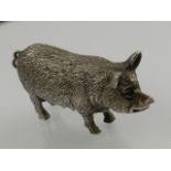 A silver figurine modelled as a pig, hallmarked London 1999,