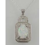 A silver cubic zirconia and opalite pendant necklace.