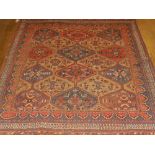 A honey ground Afshar rug, decorated with hexagonal medallions to centre,