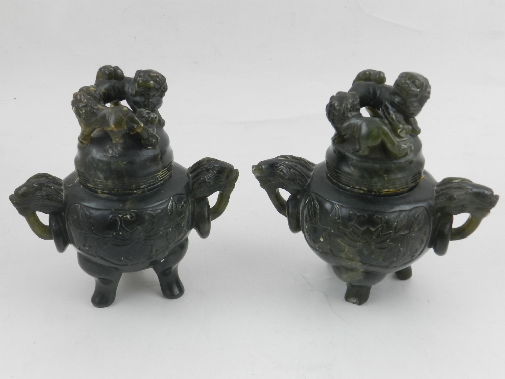 A pair of green hardstone Koros, moulded with dogs of Fo to top,