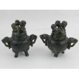 A pair of green hardstone Koros, moulded with dogs of Fo to top,