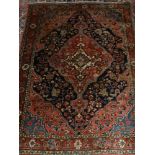 A blue ground Sarouk carpet, decorated with floral medallions within medallions, multi-bordered,