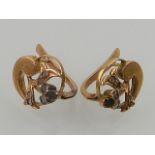 A pair of continental yellow metal floral earstuds,