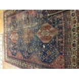 A late 19th / early 20th century blue ground Qashqai rug,