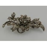 An early 20th century white and yellow metal and diamond set tremblant floral spray brooch,