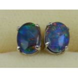 A pair of silver and doublet opal ear studs (lacking butterflies).