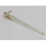 A silver paper knife, moulded with duck to end, hallmarked Andrew Barrett London 1909. L.