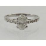 A 14 carat white gold and solitaire diamond ring, central stone of approx. 0.8 carat.