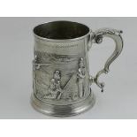 An 18th century silver tankard, embossed with soldiers, later engraved cartouche and edge,