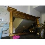 A Victorian gilt framed overmantle mirror, having carved leaf design,