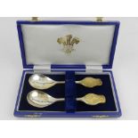 A cased pair of silver Prince of Wales spoons,