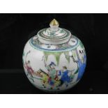 An early 20th century Chinese ginger jar, the famille vert decorating showing figures in a garden,