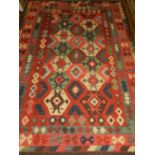 An Afghan red ground kelim rug,