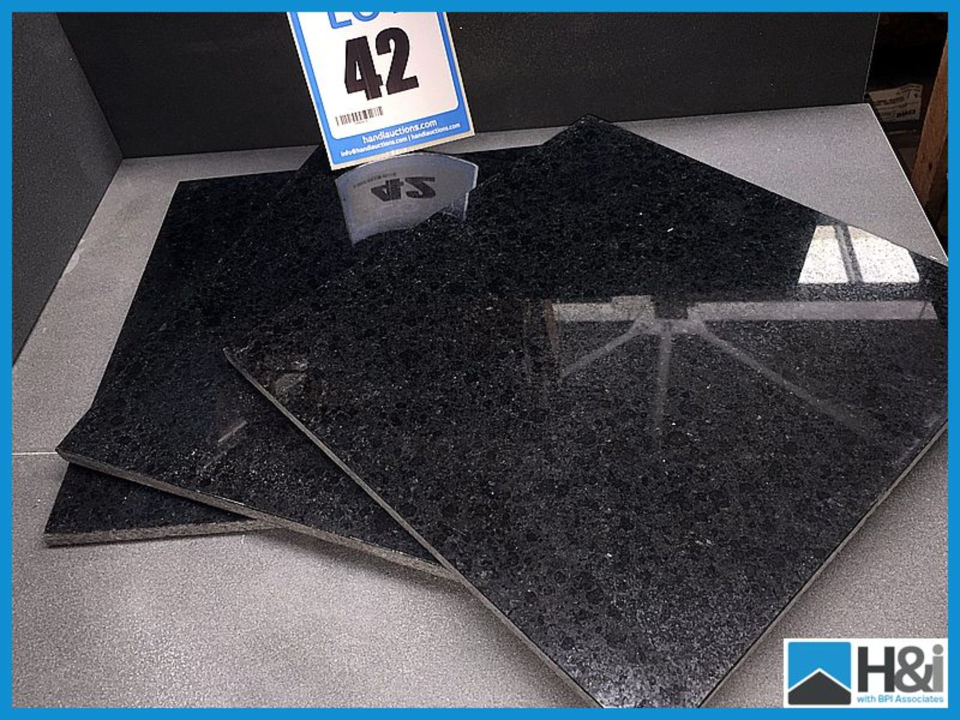 Polished granite black tiles. 305 x 305 x 8 - 10 sq metres per lot Appraisal: Good Serial No: NA