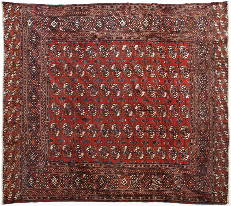 Tapis Boukhara Turkménistan 1ère moitié du XXe s. à six rangées de güls sur fond rouge 260x290 cm