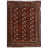 Tapis Boukhara Turkménistan milieu du XXe s. à trois rangées de güls sur fond rouge brique 146x194