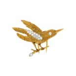 Cartier broche 2 ors 750 texturés représentant un oiseau sur sa branche serti de diamants signé