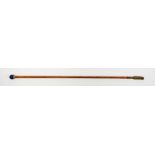 Cravache en bambou	 XXe s.	 de la Maison Laurent	 ornée d'une bille en lapis-lazuli	 long. 73 cm