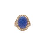 Bague en or rose 750 sertie d'une tanzanite gravée taille cabochon entourée de diamants	 doigt 54-14