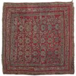 Tapis Ouchak	 Anatolie	 à décors de feuilles et de fleurs stylisées sur fond framboise	 antique