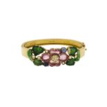 Bracelet bangle en or 750 à décor floral et végétal serti de tourmalines roses	 jade et saphirs