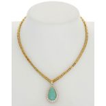 Bucherer	 collier en or 750 retenant un pendentif serti d'une turquoise cabochon taille poire