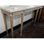 A limed oak and gilded console table with rectangular marble top, fluted frieze, on square legs