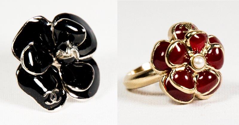 A Chanel dress ring in the form of a black enamel flower, complete with dust bag and one other