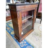 A Victorian walnut and inlaid pier cabinet fitted glass panelled door enclosing velvet lined