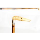 A walking stick with resin handle in the form of a dog's head and silver collar - 30in. long
