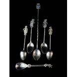 A set of four Eastern silver spoons with twist handles and figural terminals, a Dutch silver