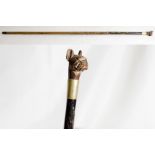 An ebonised walking cane with carved bulldog head handle - 30in. long