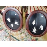A pair of late 19th Century Japanese oval lacquered panels decorated Geishas in mother of pearl