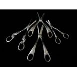 Four pairs of Victorian silver plated grape scissors with engraved flower decoration, beaded