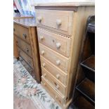 A modern pine chest fitted six drawers, turned wood knob handles, on platform base